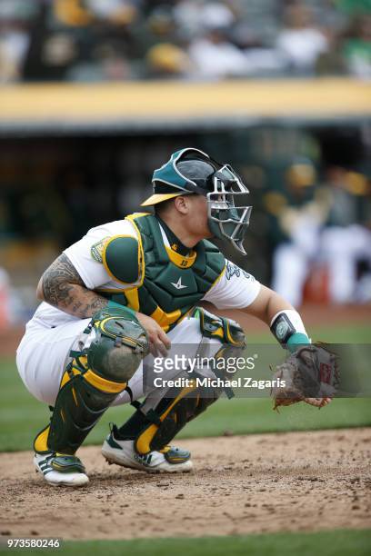 Bruce Maxwell of the Oakland Athletics catches during the game against the Seattle Mariners at the Oakland Alameda Coliseum on May 24, 2018 in...