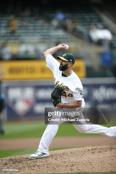 Chris Hatcher of the Oakland Athletics pitches during the game against the Seattle Mariners at the Oakland Alameda Coliseum on May 24, 2018 in...