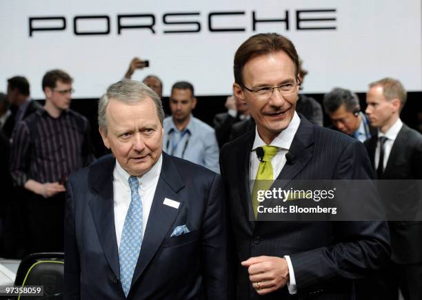 Michael Macht, chief executive officer of Porsche SE, right, poses with Wolfgang Porsche, chairman of the supervisory board of Porsche SE, on the...