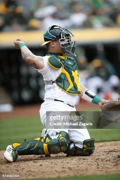 Bruce Maxwell of the Oakland Athletics catches during the game against the Seattle Mariners at the Oakland Alameda Coliseum on May 24, 2018 in...