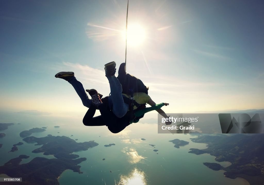 Skydiving tandem over the sea