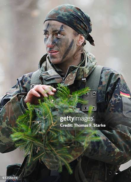 Bianca Schmidt look2 a basic military service drill at the Clausewitz barrack on February 9, 2010 in Nienburg, Germany. German women's national...