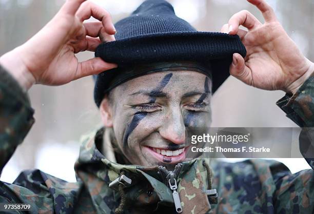 Bianca Schmidt smiles during a basic military service drill at the Clausewitz barrack on February 9, 2010 in Nienburg, Germany. German women's...