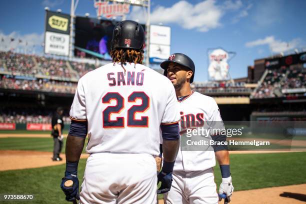 Eddie Rosario of the Minnesota Twins talks with Miguel Sano against the Cleveland Indians on June 3, 2018 at Target Field in Minneapolis, Minnesota....