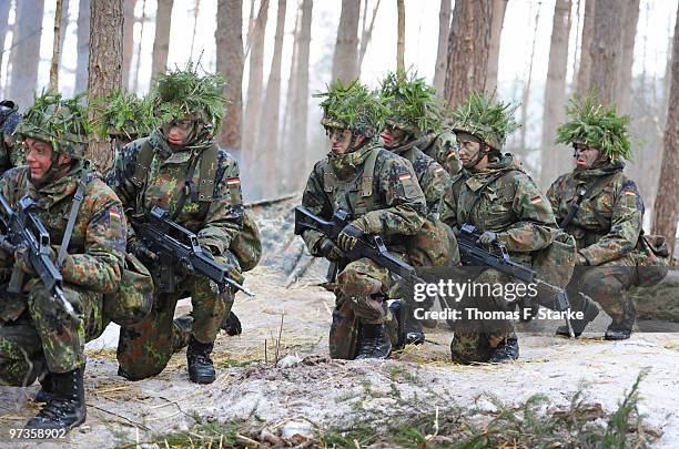 Bianca Schmidt in action during a basic military service drill at the Clausewitz barrack on February 9, 2010 in Nienburg, Germany. German women's...