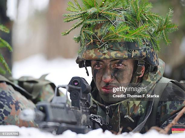 Bianca Schmidt looks on during a basic military service drill at the Clausewitz barrack on February 9, 2010 in Nienburg, Germany. German women's...