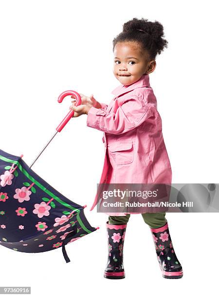 studio portrait of baby girl (18-23 months) holding umbrella - 18 23 meses fotografías e imágenes de stock