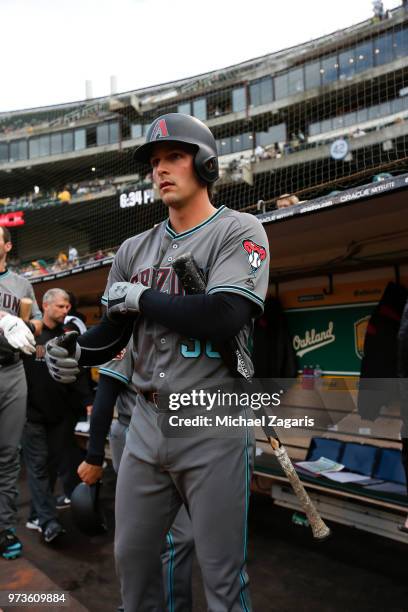 John Ryan Murphy of the Arizona Diamondbacks stands in the dugout prior to the game against the Oakland Athletics at the Oakland Alameda Coliseum on...