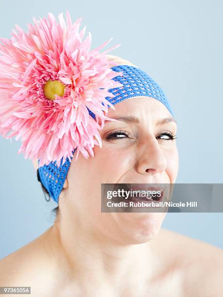 young woman dressed as a baby, portrait, studio shot - man acting being shot stock-fotos und bilder