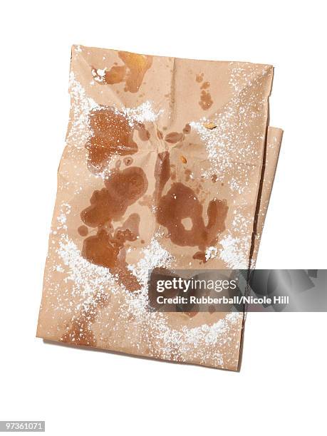 empty paper bag stained with oil and powdered sugar, view from above, studio shot - obesity epidemic stock pictures, royalty-free photos & images