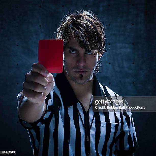 studio shot of referee showing red card - red card stock pictures, royalty-free photos & images