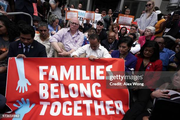 Demonstrators including U.S. Rep. Judy Chu , Rep. John Lewis , Rep. Al Green , Rep. John Lewis and Rep. Luis Gutierrez participate in a moment of...