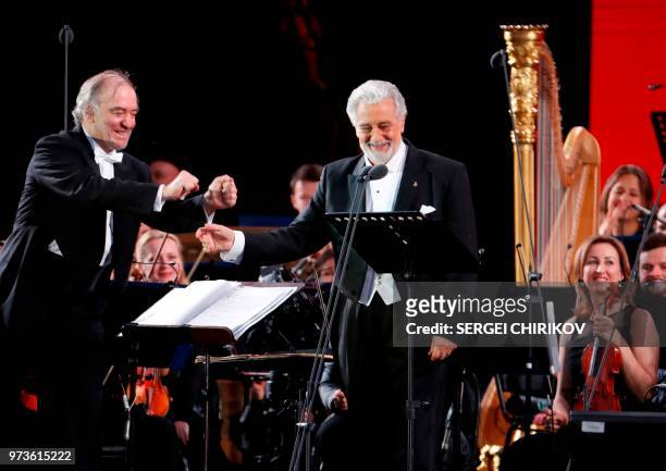 Russian conductor Valery Gergiev and Spanish tenor Placido Domingo participate in a gala-concert dedicated to the Russia 2018 World Cup football...