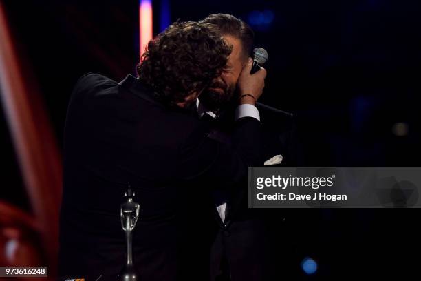 Michael Ball kisses Alfie Boe during the 2018 Classic BRIT Awards held at Royal Albert Hall on June 13, 2018 in London, England.