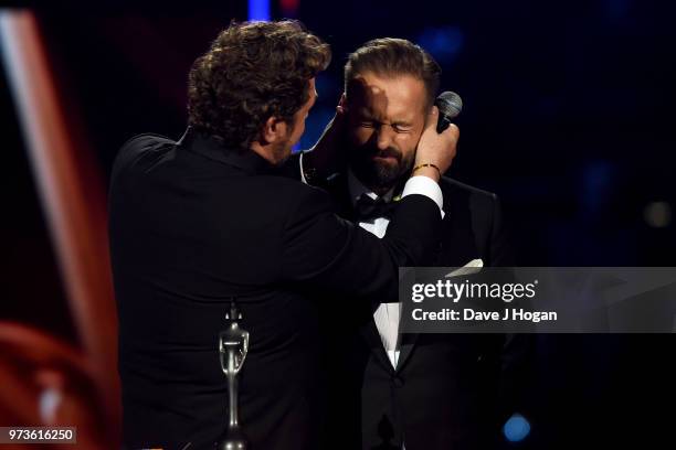 Michael Ball kisses Alfie Boe during the 2018 Classic BRIT Awards held at Royal Albert Hall on June 13, 2018 in London, England.