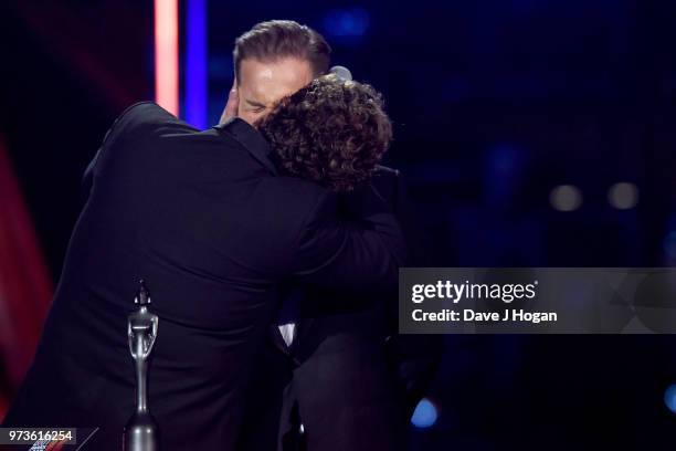 Michael Ball kisses Alfie Boe during the 2018 Classic BRIT Awards held at Royal Albert Hall on June 13, 2018 in London, England.