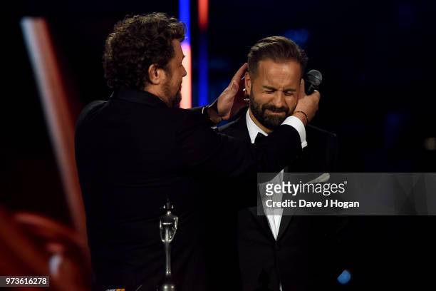 Michael Ball kisses Alfie Boe during the 2018 Classic BRIT Awards held at Royal Albert Hall on June 13, 2018 in London, England.