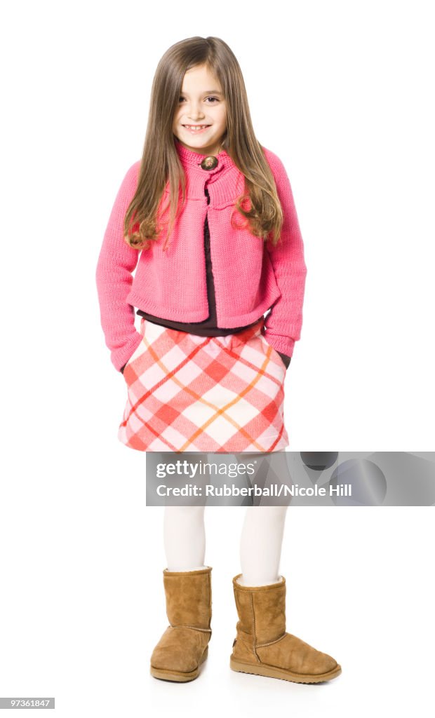 Studio portrait of girl (8-9) smiling