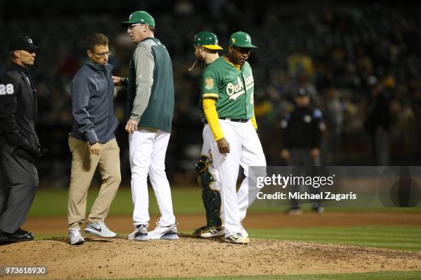 Santiago Casilla of the Oakland Athletics leaves with shoulder tightness during the game against the Arizona Diamondbacks at the Oakland Alameda...