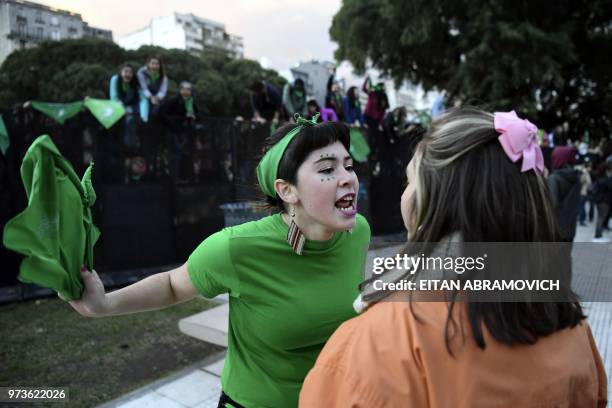 Pro-choice activist argues with a woman opposed to the legalization of abortion outside the Argentine Congress in Buenos Aires, on June 13, 2018. -...