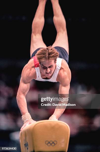 Morgan Hamm of the United States competes on the vault during the Men's Gymnastics events of the Olympic Games during September 2000 in Sydney,...