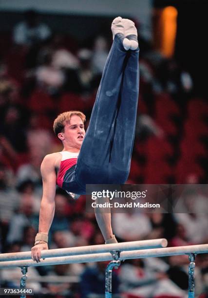 Morgan Hamm of the United States competes on the parallel bars during the Men's Gymnastics events of the Olympic Games during September 2000 in...