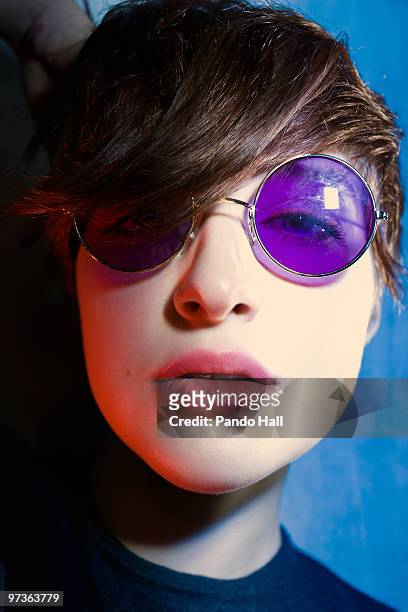 portrait of a young woman with sunglasses - granny glasses stockfoto's en -beelden