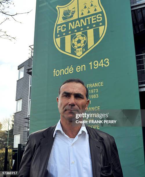 New coach of French L 2 football team FC Nantes, Baptiste Gentili poses in front of the club board after a press conference to introduce him, at the...