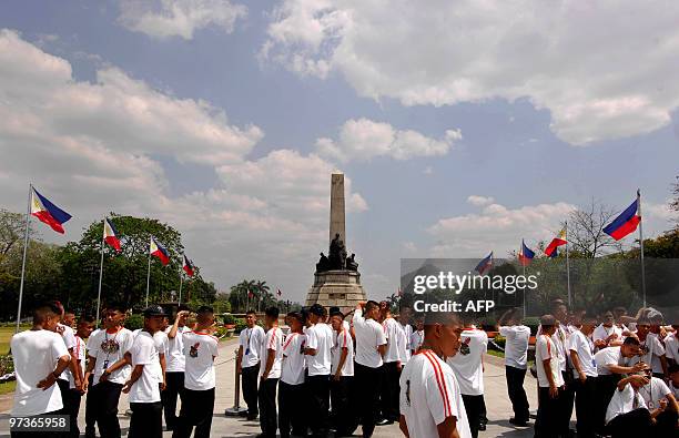 Students visiy the Jose Rizal monument at the Luneta Park in Manila on March 01, 2010. Rizal was a national hero of the Philippines and a prominent...