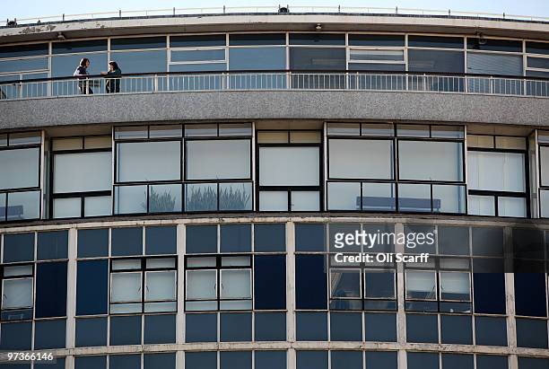 Two BBC employees chat on the balcony of BBC Television Centre on March 2, 2010 in London, England. The corporation have today published their...