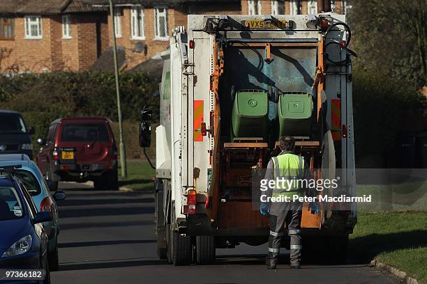 Refuse collectors empty green 'wheelie' bins on March 2, 2010 near Leatherhead, England. As the UK gears up for one of the most hotly contested...