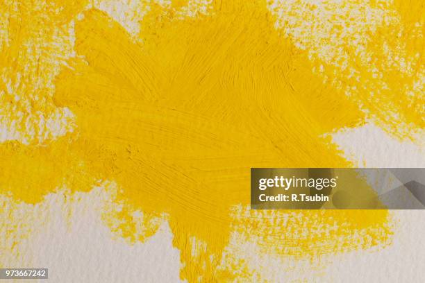 close up of the yellow paint strokes texture - schmiererei stock-fotos und bilder