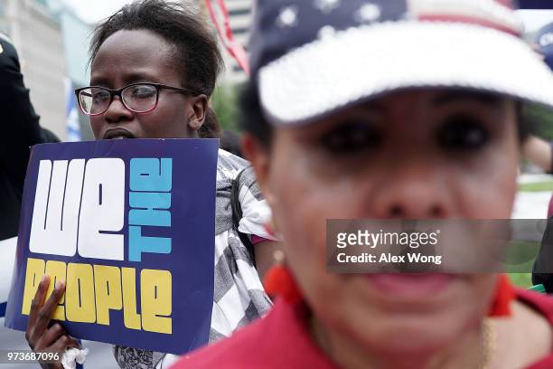 Demonstrators participate in a protest June 13, 2018 in Washington, DC. Democratic congressional members joined actives to protest "the Trump...