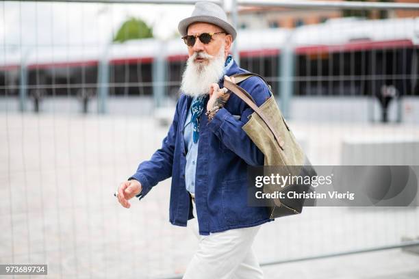 Guest with withe beard wearing hat is seen during the 94th Pitti Immagine Uomo on June 13, 2018 in Florence, Italy.