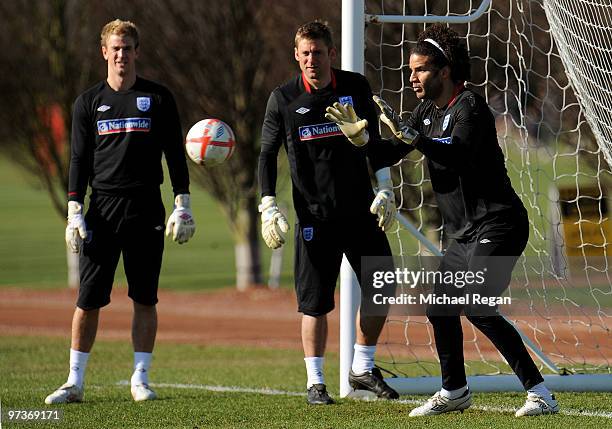 David James goes through drills as Robert Green and Joe Hart look on during an England training session at London Colney on March 2, 2010 in St...