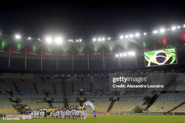 Players of Fluminense and Santos listen the national anthem before the match between Fluminense and Santos as part of Brasileirao Series A 2018 at...