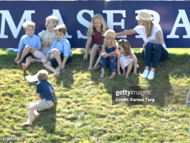 Savannah Phillips gets a telling off from her mother Autum Phillips after she pushed Prince George of Cambridge down the hill during the Maserati...