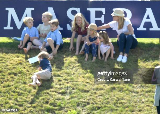 Savannah Phillips gets a telling off from her mother Autum Phillips after she pushed Prince George of Cambridge down the hill during the Maserati...