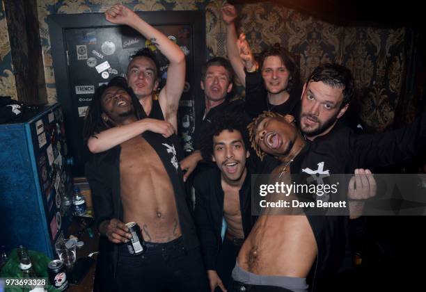 Noel Gallagher celebrates backstage with Seye Adelekan, Jeff Wootton, Twiggy Garcia, Jay Sharrock, Young Lazarus and Jamie Reynolds of YOTA following...