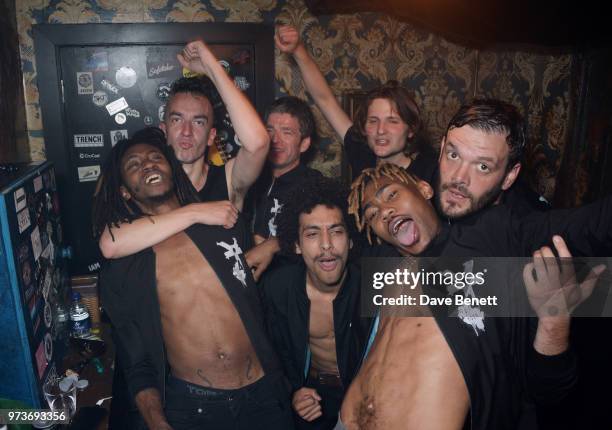 Noel Gallagher celebrates backstage with Seye Adelekan, Jeff Wootton, Twiggy Garcia, Jay Sharrock, Young Lazarus and Jamie Reynolds of YOTA following...