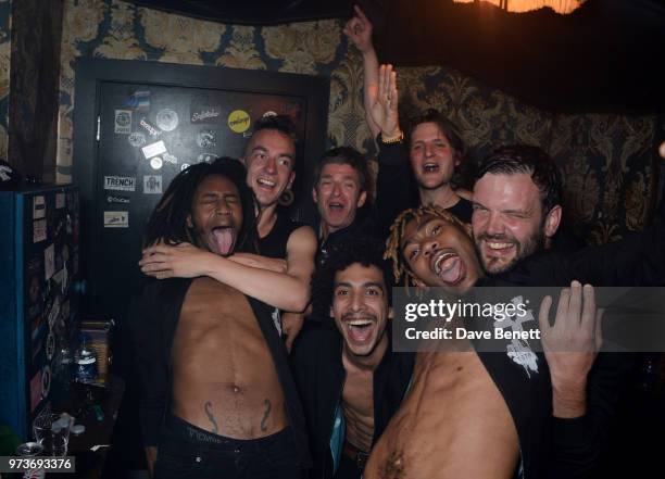 Noel Gallagher celebrates backstage with Seye Adelekan, Jeff Wootton, Twiggy Garcia, Jay Sharrock, Young Lazarus and Jamie Reynolds of YOTA following...