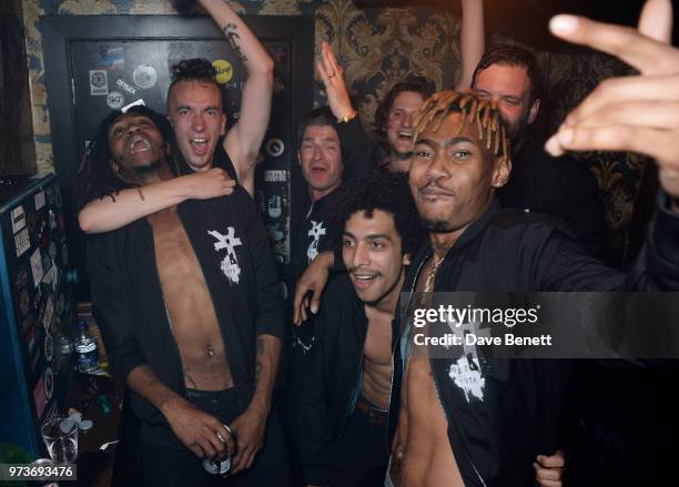 Noel Gallagher celebrates backstage with Seye Adelekan, Jeff Wootton, Twiggy Garcia, Jay Sharrock, Young Lazarus and Jamie Reynolds of YOTA following...