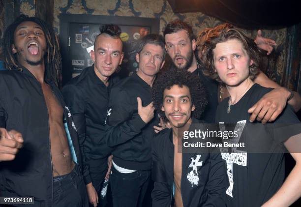 Noel Gallagher celebrates backstage with Seye Adelekan, Jeff Wootton, Twiggy Garcia, Young Lazarus, Jamie Reynolds and Jay Sharrock of YOTA following...