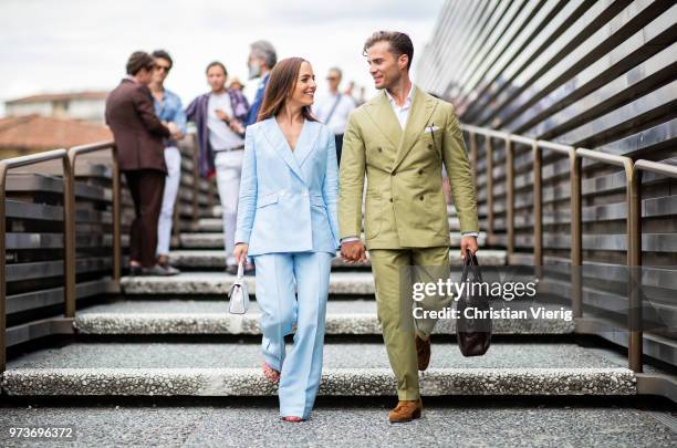 Couple Martina Gronowska wearing blue double breasted linen suit Massimo Dutti, Gestuz shoes, Michael Kors bag and Michal Gronowski wearing coton...