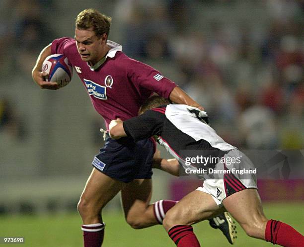 Nathan Williams of the Queensland Reds gets past Ben Blair of the Canterbury Crusaders during the Southern X Rugby Union competition played at...