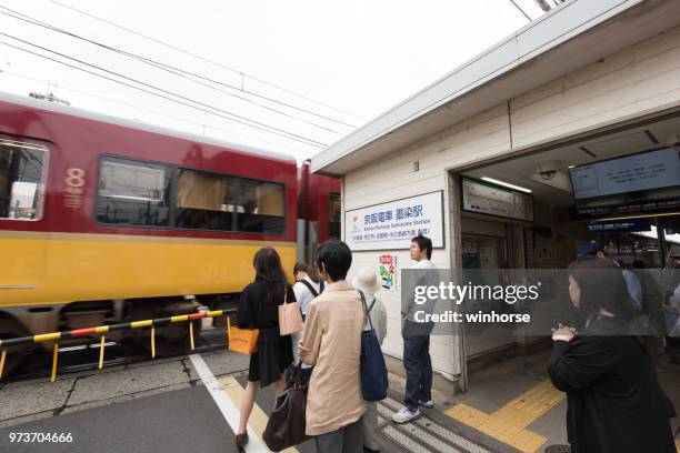 railroad crossing at sumizome station in kyoto, japan - kyoto station stock pictures, royalty-free photos & images