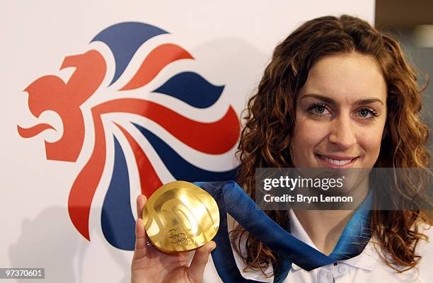 Olympic Skeleton Gold medalist Amy Williams poses with her medal at theTeam GB Welcome Home Press Conference at Heathrow Airport on March 2, 2010 in...