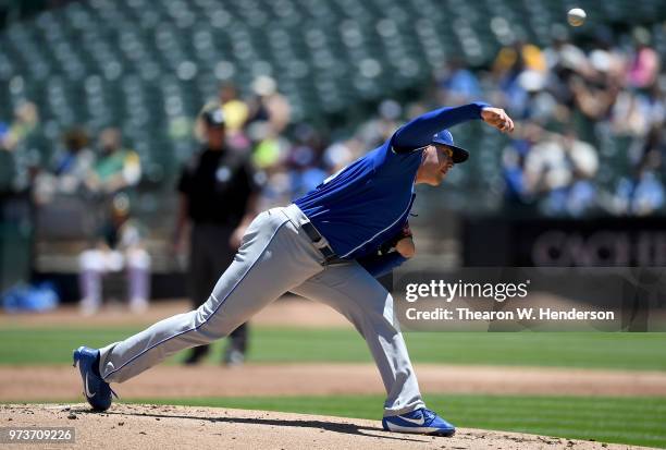 Brad Keller of the Kansas City Royals pitches against the Oakland Athletics in the bottom of the first inning at the Oakland Alameda Coliseum on June...