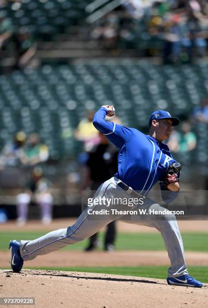 Brad Keller of the Kansas City Royals pitches against the Oakland Athletics in the bottom of the first inning at the Oakland Alameda Coliseum on June...