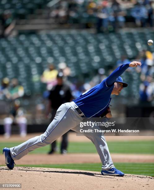 Brad Keller of the Kansas City Royals pitches against the Oakland Athletics in the bottom of the first inning at the Oakland Alameda Coliseum on June...